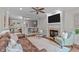 Comfortable living room boasts a fireplace, built-in bookshelves, and rich hardwood floors at 7929 Pine Timber Dr, Raleigh, NC 27613