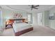 Light and airy main bedroom featuring a ceiling fan and ensuite bathroom at 7929 Pine Timber Dr, Raleigh, NC 27613