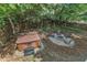 Secluded backyard featuring a hot tub, fire pit, and outdoor seating, creating a private oasis at 8504 Delavan Cir, Raleigh, NC 27613