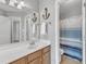 Comfortable bathroom featuring a white countertop and an open door to the shower and toilet at 8504 Delavan Cir, Raleigh, NC 27613