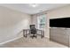 Bedroom with a desk, TV, and dresser, perfect for work or relaxing at 8504 Delavan Cir, Raleigh, NC 27613