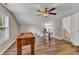 Spacious bonus room featuring wood floors, a foosball table, and a desk at 8504 Delavan Cir, Raleigh, NC 27613