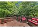 Relaxing deck featuring stylish wicker furniture and string lights, ideal for outdoor entertaining at 8504 Delavan Cir, Raleigh, NC 27613