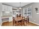 Dining room with a large wooden table and seating for six at 8504 Delavan Cir, Raleigh, NC 27613
