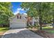 Attractive two-story home with a spacious driveway and a beautifully landscaped front yard at 8504 Delavan Cir, Raleigh, NC 27613