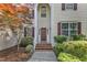 Inviting front entrance with a classic door, brick steps and a well-manicured garden at 8504 Delavan Cir, Raleigh, NC 27613
