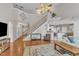Living room showcasing hardwood floors, staircase to the second floor, and opening to the kitchen at 8504 Delavan Cir, Raleigh, NC 27613