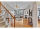 Inviting living room with high ceilings, a fireplace, and large windows providing lots of natural light at 8504 Delavan Cir, Raleigh, NC 27613
