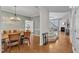 Spacious open floor plan with dining room leading into the living room at 8504 Delavan Cir, Raleigh, NC 27613