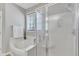 Bright bathroom featuring a soaking tub and shower at 8504 Delavan Cir, Raleigh, NC 27613