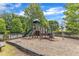 Community playground with slides and climbing structures, offering a fun and safe play area for children at 8504 Delavan Cir, Raleigh, NC 27613