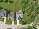 This aerial view shows a home with a large, fenced backyard and mature trees, providing privacy and space for outdoor activities at 851 Dotson Way, Apex, NC 27523