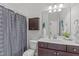 Well-lit bathroom with vanity and shower at 851 Dotson Way, Apex, NC 27523