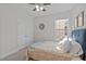 Cozy bedroom features a ceiling fan, natural light, and closet at 851 Dotson Way, Apex, NC 27523