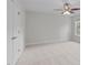 Spacious bedroom with plush carpeting, a ceiling fan, and a window offering outdoor views at 851 Dotson Way, Apex, NC 27523