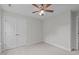 Bedroom with plush carpeting, and closet with double doors and a ceiling fan at 851 Dotson Way, Apex, NC 27523