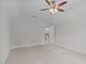 A carpeted attic bedroom leads to a staircase visible through a doorway at 851 Dotson Way, Apex, NC 27523