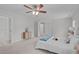 Bright primary bedroom with a ceiling fan and doorways leading to other rooms at 851 Dotson Way, Apex, NC 27523