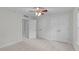 Bedroom with double closets, a ceiling fan, light carpeting, and neutral colored walls at 851 Dotson Way, Apex, NC 27523
