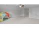 Carpeted attic bedroom with a ceiling fan and a play tent at 851 Dotson Way, Apex, NC 27523