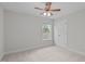 Carpeted bedroom featuring natural light and a ceiling fan at 851 Dotson Way, Apex, NC 27523