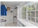 Bright walk-in closet featuring built-in shelving and a large window for natural light at 851 Dotson Way, Apex, NC 27523