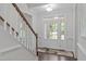 Bright foyer with beautiful trim, hardwood floors, and front door access at 851 Dotson Way, Apex, NC 27523