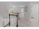 Upstairs hallway with natural light from the window at 851 Dotson Way, Apex, NC 27523