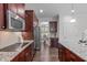 Gourmet kitchen features stainless appliances, granite countertops, and custom cabinets at 851 Dotson Way, Apex, NC 27523