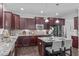 Well-equipped kitchen with granite countertops, stainless appliances, and hardwood floors, ready for cooking at 851 Dotson Way, Apex, NC 27523