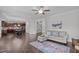 Open-concept living room flows into the kitchen, creating a perfect space for entertaining and everyday living at 851 Dotson Way, Apex, NC 27523