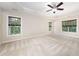 Spacious bedroom features large windows, trey ceilings, and neutral-toned carpet at 9 Sandhill Ln, Durham, NC 27713