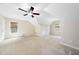 Large bedroom with carpet floors, neutral colors, and natural lighting from two windows with wooden blinds at 9 Sandhill Ln, Durham, NC 27713