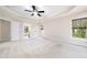 Large bedroom with windows, neutral walls, carpet, and an attached closet at 9 Sandhill Ln, Durham, NC 27713