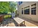 Wooden deck featuring a gas grill, and bench perfect for outdoor cooking and entertaining guests at 9 Sandhill Ln, Durham, NC 27713