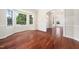 Open dining room with natural light, archways, and beautiful hardwood flooring at 9 Sandhill Ln, Durham, NC 27713