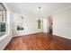Bright dining room with hardwood floors and large windows providing ample natural light at 9 Sandhill Ln, Durham, NC 27713