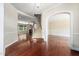 Spacious foyer with hardwood floors, a staircase, and views into other rooms at 9 Sandhill Ln, Durham, NC 27713