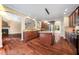 Open-concept kitchen features stainless steel appliances, granite countertops, a center island, and hardwood flooring throughout at 9 Sandhill Ln, Durham, NC 27713