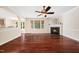 Spacious living room with fireplace, hardwood floors, and natural light at 9 Sandhill Ln, Durham, NC 27713