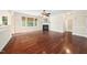 Spacious living room with fireplace, large windows, and hardwood floors at 9 Sandhill Ln, Durham, NC 27713