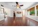Open living room with hardwood floors, ceiling fan, and kitchen access at 9 Sandhill Ln, Durham, NC 27713