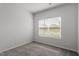 This bedroom features a carpeted floor, window with blinds, and electrical outlets at 910 Rhino Bnd, Oxford, NC 27565