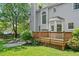 Wooden backyard deck perfect for entertaining, overlooking the large grassy backyard at 9400 Leslieshire Dr, Raleigh, NC 27615