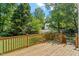 Wooden backyard deck perfect for entertaining, overlooking the large grassy backyard at 9400 Leslieshire Dr, Raleigh, NC 27615