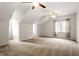 This carpeted bedroom has vaulted ceilings, and a ceiling fan, perfect for relaxation at 9400 Leslieshire Dr, Raleigh, NC 27615