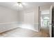 Cozy bedroom with plush carpet, neutral walls, and a double-door closet for ample storage at 9400 Leslieshire Dr, Raleigh, NC 27615