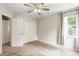 Bedroom features include carpet flooring, a ceiling fan, closet and a window at 9400 Leslieshire Dr, Raleigh, NC 27615