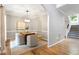 Elegant dining room featuring modern lighting, stylish chairs, and hardwood floors at 9400 Leslieshire Dr, Raleigh, NC 27615