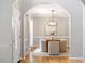 Elegant dining room with hardwood floors, decorative chandelier, and stylish decor at 9400 Leslieshire Dr, Raleigh, NC 27615